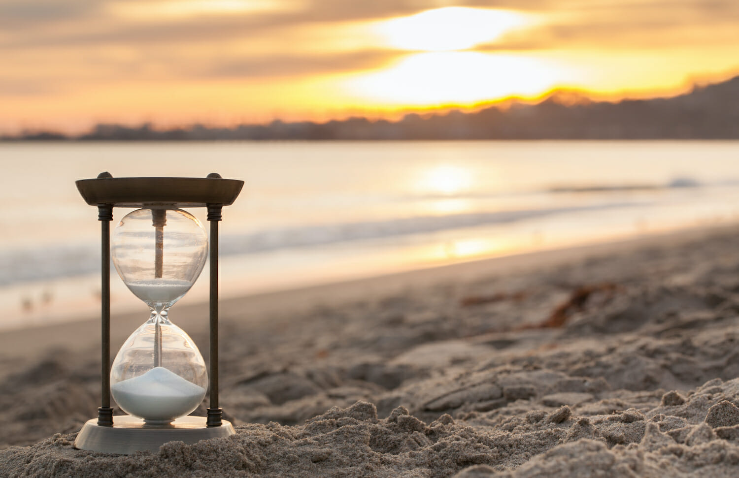 Hourglass on the beach at sunset - What goals should I set for 2021?